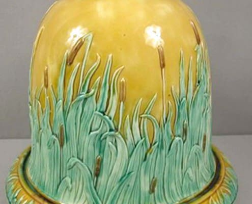 Adams-and-Bromley-majolica-cow-cheese-keeper Cow and cattail cheese keeper
